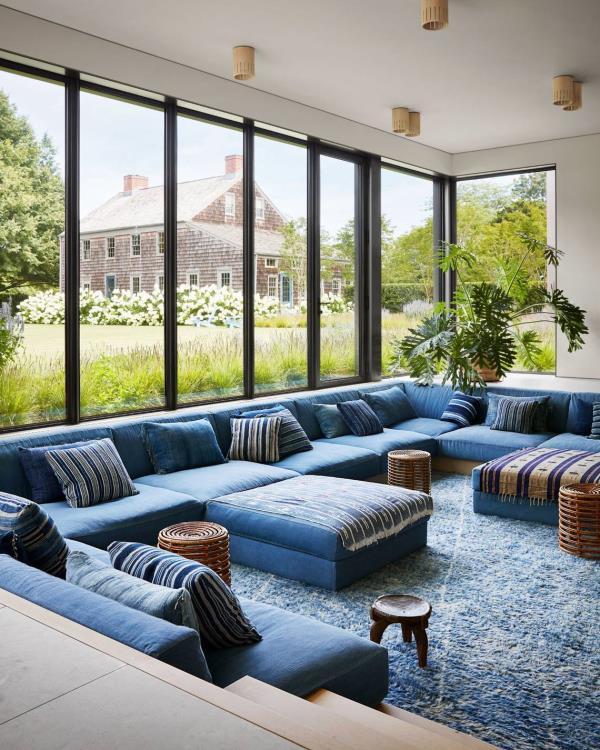  The sunken lounge inside this East Hampton compound is outfitted with a custom sofa system covered in Japanese denim. Photo: Stephen Kent Johnson